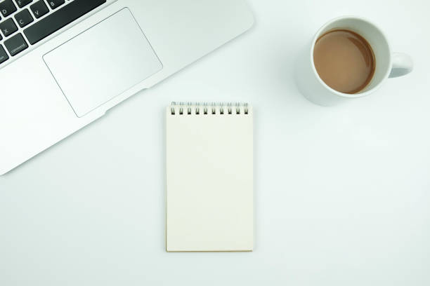 istock Creative flat lay design of workspace desk with laptop, notebook and coffee 955700710