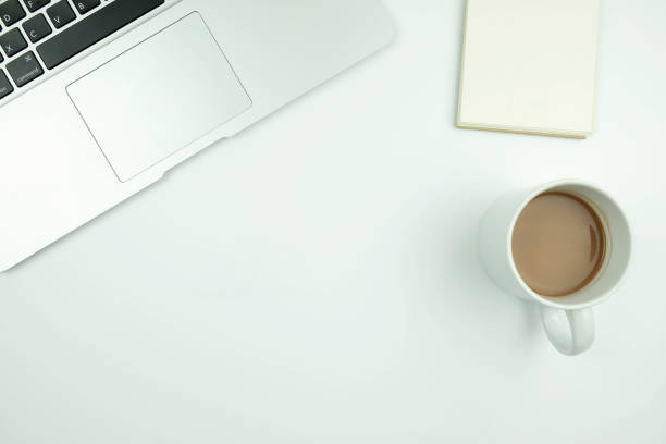 istock Creative flat lay design of workspace desk with laptop, notebook and coffee 955700714