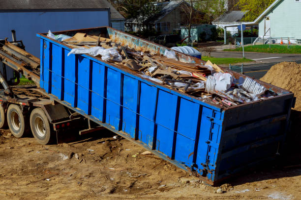 Truck loading a full skip recycling garbage waste management container Truck loading a recycling garbage full skip waste management container scrap metal stock pictures, royalty-free photos & images