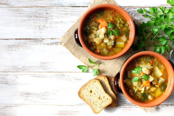 istock Vegetables soup on the wooden table. 955707450