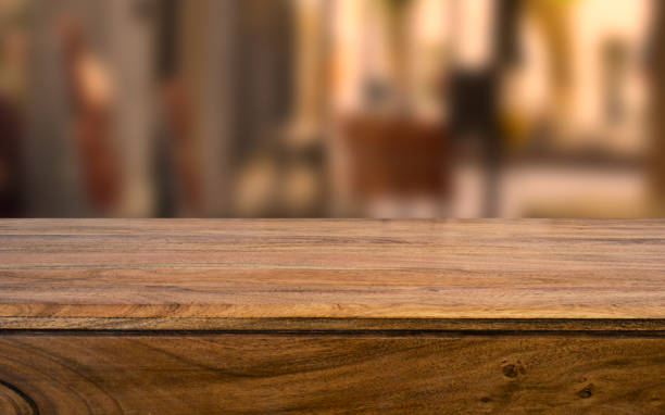 istock Wooden board empty table blur in coffee shop. 955707464
