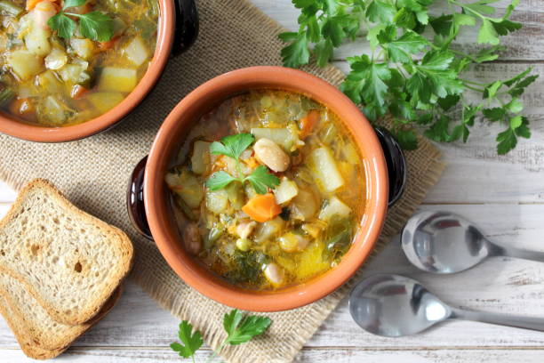 istock Vegetables soup on the wooden table. 955707542