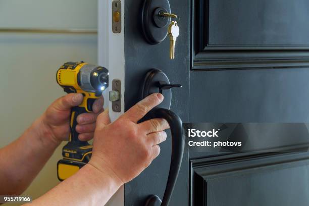 House Exterior Door With The Inside Internal Parts Of The Lock Visible Of A Professional Locksmith Installing Or Repairing A New Deadbolt Lock Stock Photo - Download Image Now