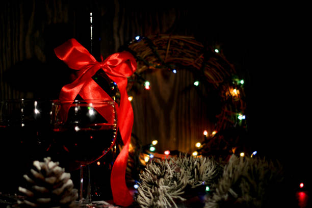istock Red wine, bottle and christmas ornaments, selctive focus, and celebration 955720420