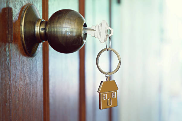 istock House key with home keyring in keyhole, property concept 955724840