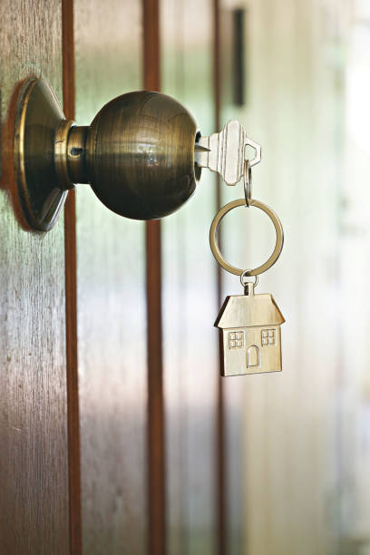 istock House key with home keyring in keyhole, property concept 955724920