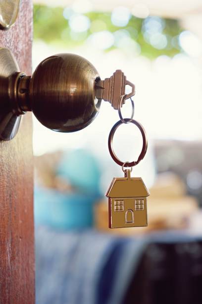 istock House key with home keyring in keyhole, property concept 955724956