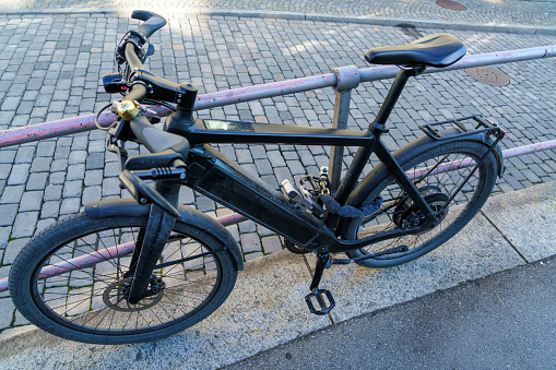 Electric bike, chained with several strong locks and chains
