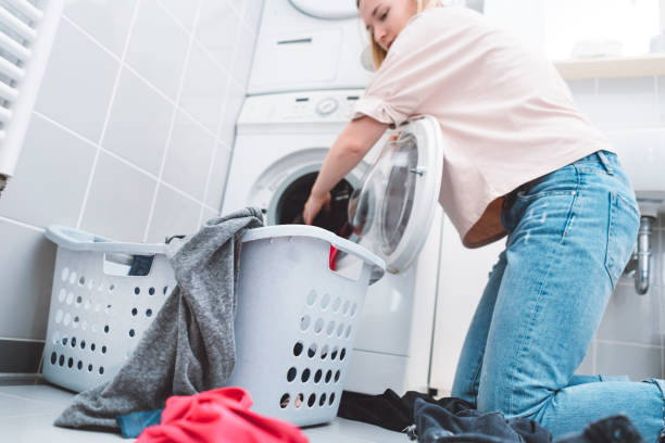 istock Girl being productive in the laundry room 955737688