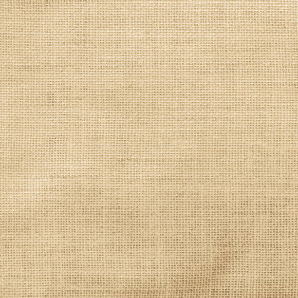 istock Hessian sack cloth texture canvas fabric pattern background in light yellow cream brown color 955744882