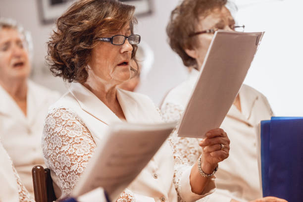 istock Senior Women Singing at Choir Practice 955748810