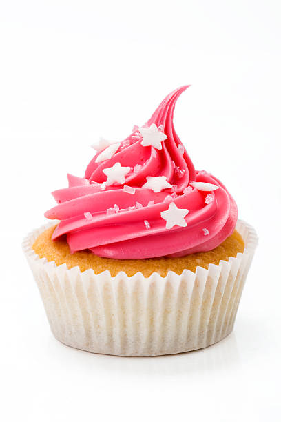 istock Cupcake topped with pink cream decorated with white stars 95574958