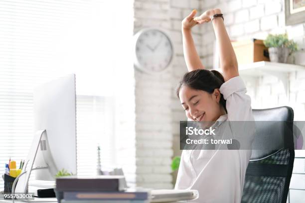 Businesswoman Relax From Work At The Office Stock Photo - Download Image Now - Working, Relaxation, Ergonomics