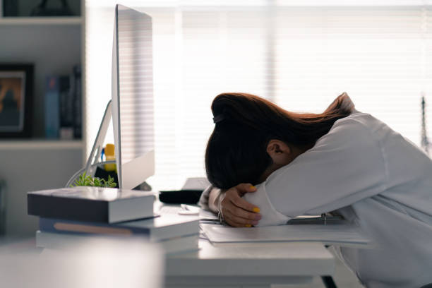 Businesswoman she was lying on the table, she was tired of working in the office. Businesswoman she was lying on the table, she was tired of working in the office. narcolepsy stock pictures, royalty-free photos & images