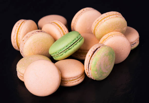 istock Many colored sweet macaroons cookie. Can be used as a background. Selective focus 955760406