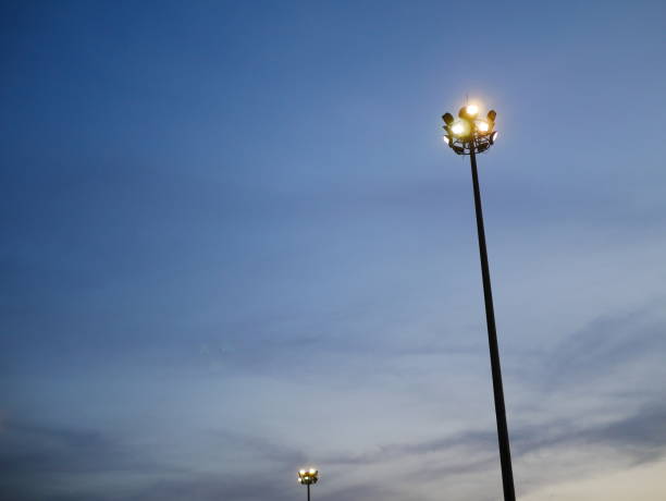 istock LED street lamp post with blue sky cloud 955763684