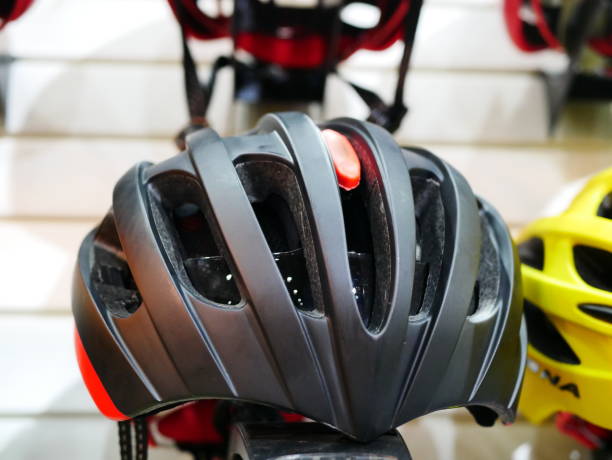 istock Stand with helmets in bicycle shop 955767696