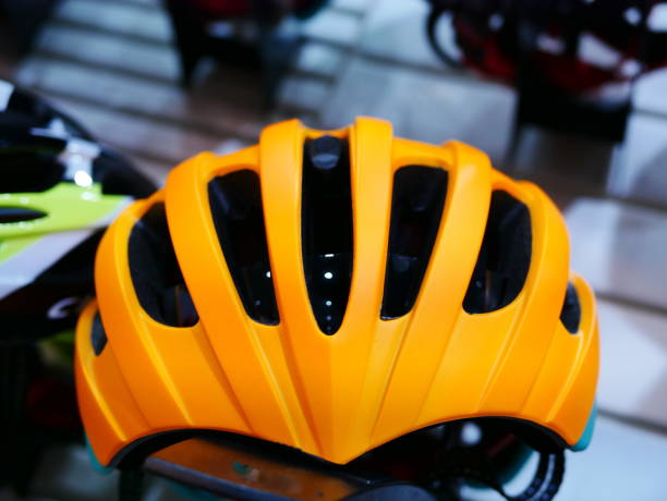 istock Stand with helmets in bicycle shop 955767712