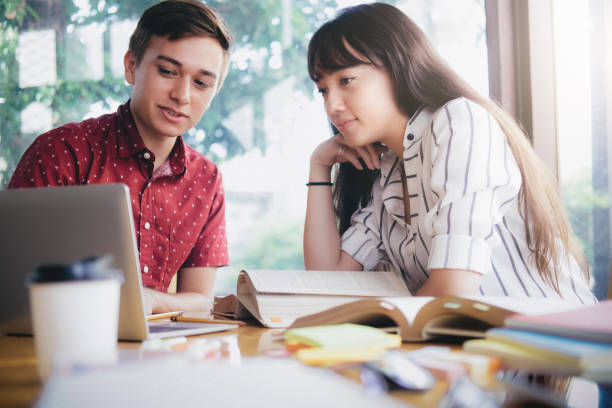 istock Young students campus helps friend catching up and learning 955768238