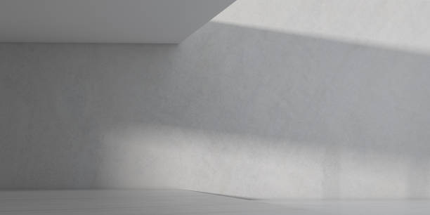 istock 3D stimulate of white room interior space and concrete floor with sun light cast rhythm of shadow on the wall,Perspective of minimal design architecture 955768676