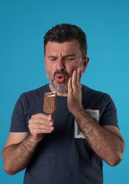 istock Mid adult man experiencing tooth ache 955771894