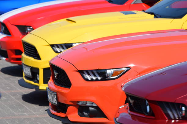 Warsaw, Poland - April 21, 2018: Ford Mustang cars stopped on the parking during the public Meeting of Ford Mustang Friends. The Mustang is the one of the most popular and attractive coupe and roadster vehicles in the world.
