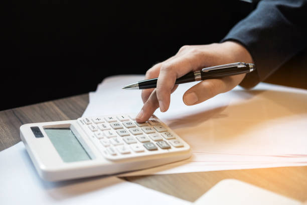 istock Professional business woman working with calculator, Doing finance on laptop, document graph and analysis business strategy to development profit 955777492