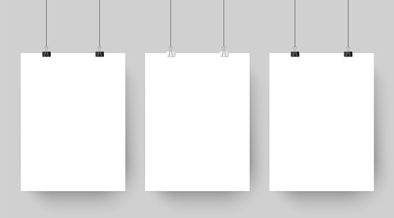 Empty affiche mockup hanging on paper clips. White blank advertising poster template casts shadow on gray background. three canvas photo sheets vector illustration