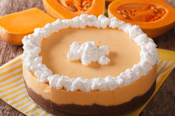 istock pumpkin cheesecake decorated with whipped cream. the toning. 955781736