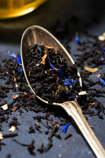 istock dry herbal tea in a spoonful, vertical 955784354