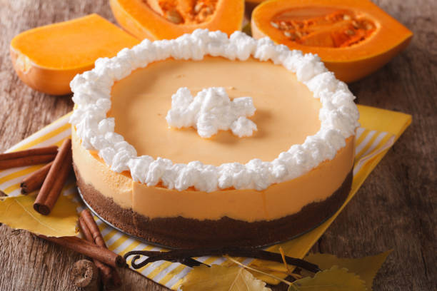 istock pumpkin cheesecake with cinnamon, vanilla and whipped cream close-up. horizontal 955784704
