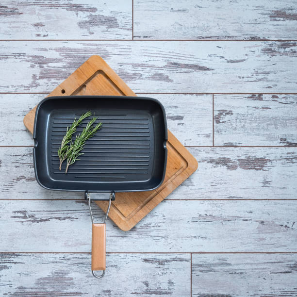 istock Grill pan with a sprig of rosemary, top view 955787448