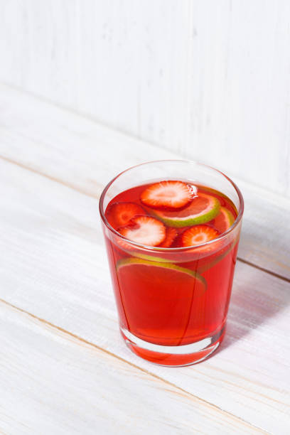 istock strawberry citrus lemonade on a white background, vertical 955787622