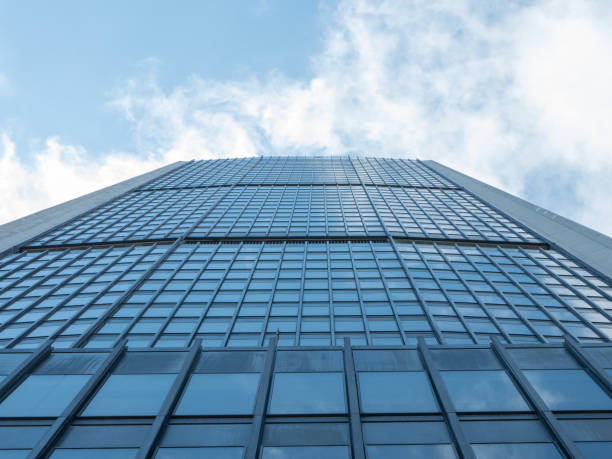 istock Angle view of modern building with a cloudy blue sky in background 955788866