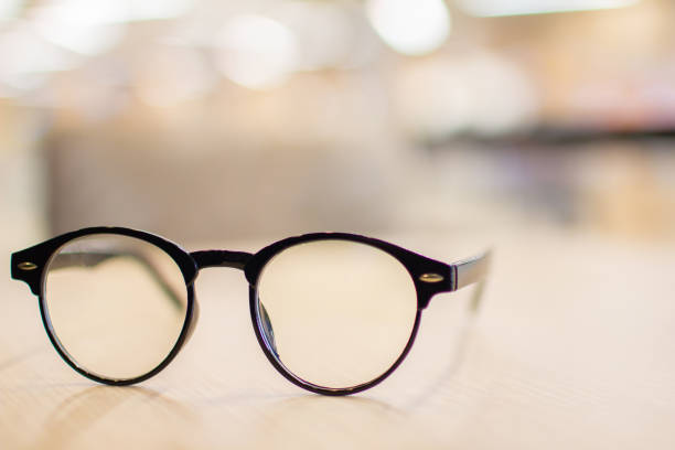istock Vintage glasses,on wood table, Studying examining. learning. People, learning, education 955789080