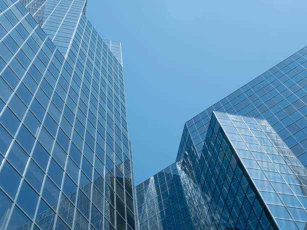 istock Angle view of modern building with a clear blue sky in background 955789204