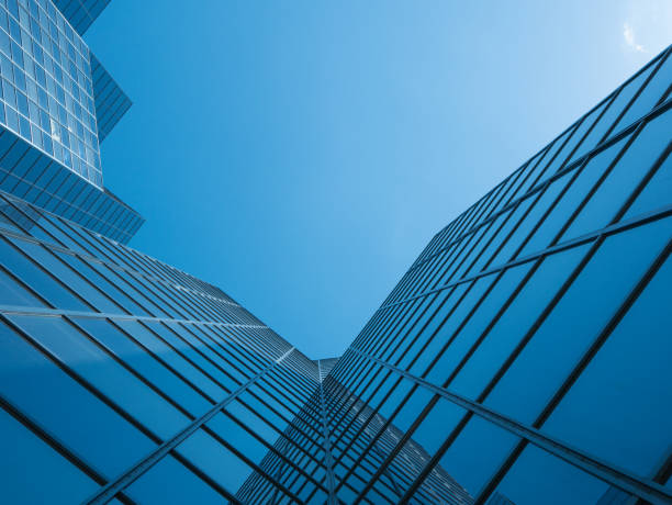 istock Angle view of modern building with a clear blue sky in background 955789278