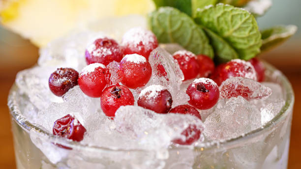 istock Cranberries on ice in a glass garnish for a cocktail close-up 955791552