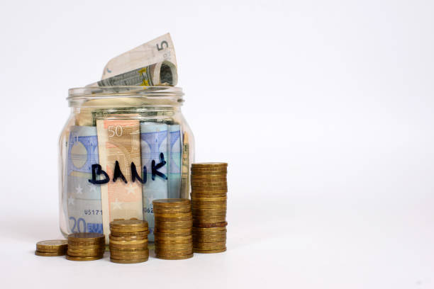 istock Money jar with bank marker isolated on white. 955795944
