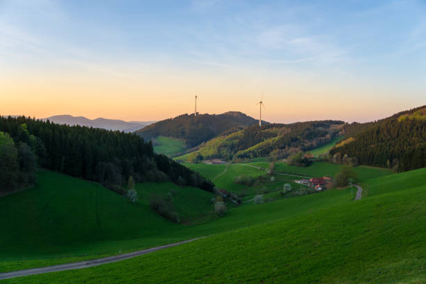 istock Germany, Black Forest sunset Nature landscape with wind turbines 955796660