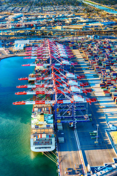 Port of Long Beach Aerial Cargo ships, containers, and cranes in one of the largest ports in the western United States, the Port of Long Beach located i just west of downtown Los Angeles, California and adjacent to San Pedro and the Port of Los Angeles.  This image was shot from an altitude of about 1000 feet. san pedro los angeles photos stock pictures, royalty-free photos & images