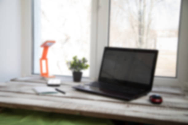 istock Laptop on the wood table . 955803270