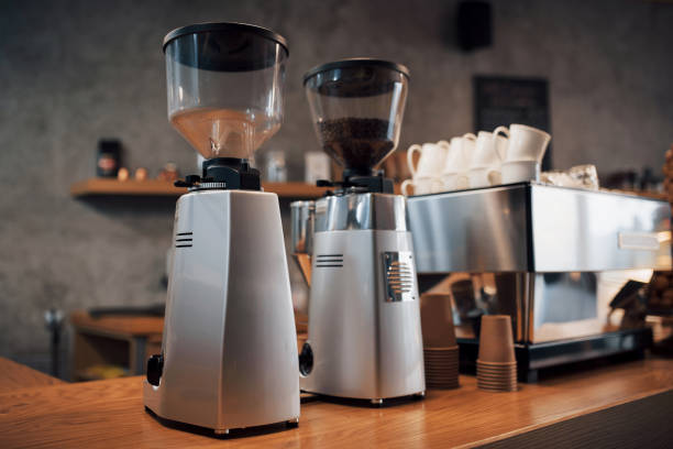 istock Professional black electric grinder is on a wooden table 955809184