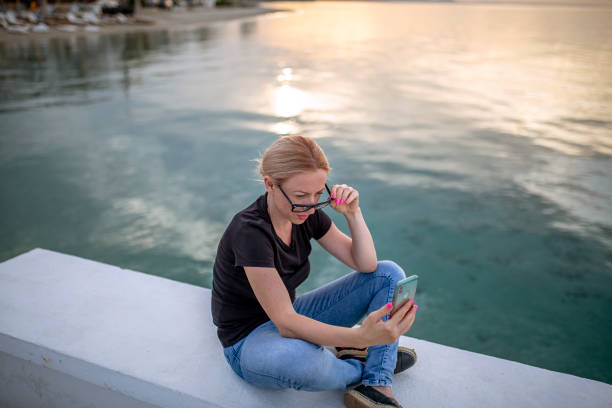 Young woman enjoying by the sea