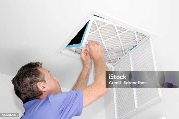 Man Removing Dirty Air Filter Stock Photo - Download Image Now - Air Duct, Air Conditioner, Cleaning