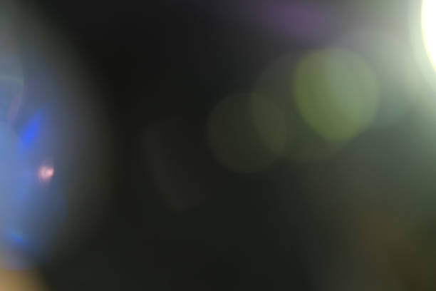 istock lens flare colorful abstract bokeh light black 955813196