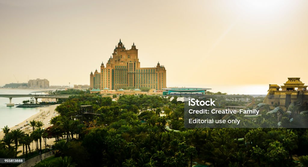 Atlantis hotel on the Palm Jumeirah island, view from the water park Dubai, United Arab Emirates - February 24, 2018: Atlantis hotel on the Palm Jumeirah island, view from the water park, tourist attraction in Dubai, United Arab Emirates Aerial View Stock Photo