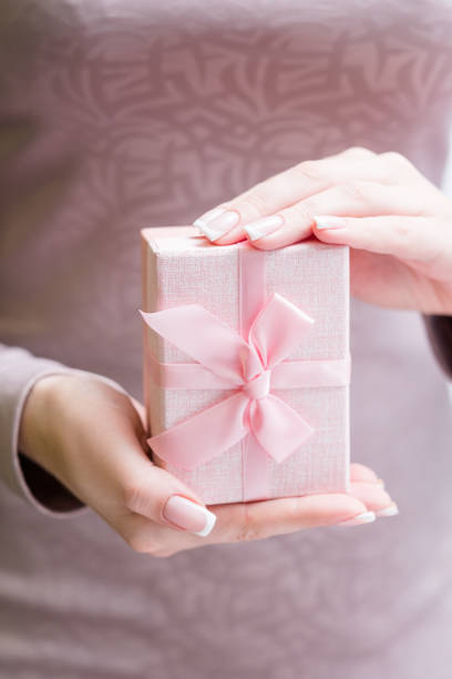 istock woman hold present package holiday gift 955814006