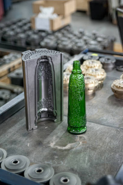 istock Tooling for glass bottle injection and bottle 955823774