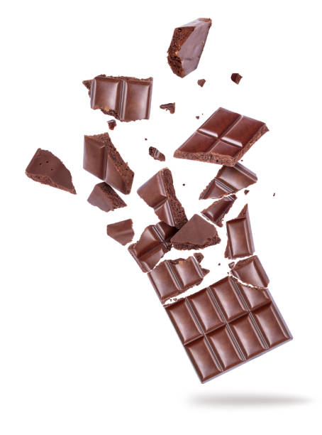 istock Porous dark chocolate broken into pieces in the air on a white background 955824302